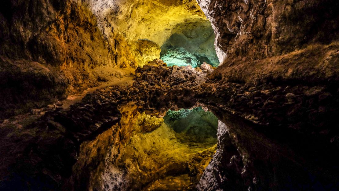An underground mirror lake is a highlight of La Cueva de los Verdes.