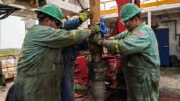 Workers extract oil from the Permian Basin, the booming shale oilfield in West Texas. (Photo by Benjamin Lowy/Getty Images)