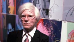 The American artist and filmmaker Andy Warhol with his paintings (1928- 1987), December 15, 1980. (Photo by Susan Greenwood / Liaison Agency)