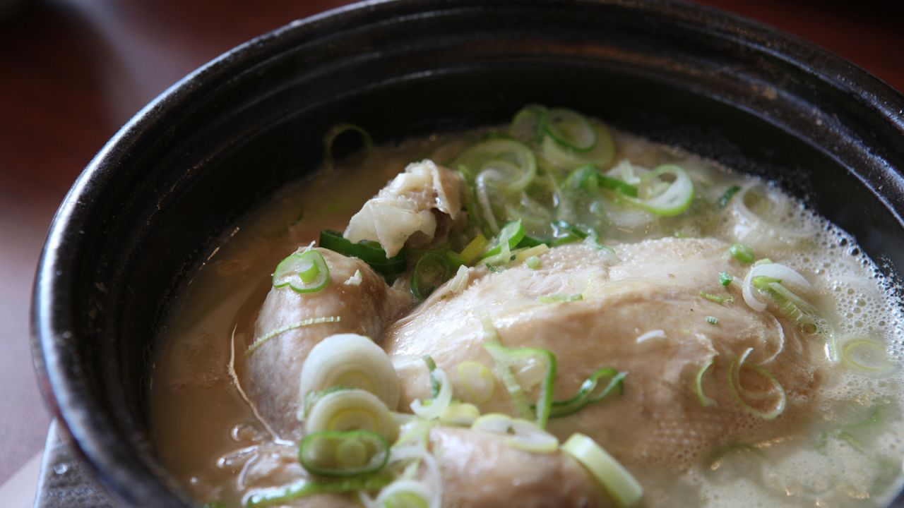 <strong>Samgyetang: </strong>Samgyetang is a thick, glutinous soup with a whole chicken stuffed with ginseng. The cooking process tones down the ginseng's signature bitterness and leaves an oddly appealing, aromatic flavor in its stead.