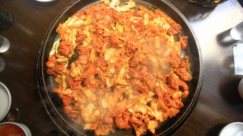 <strong>Chuncheon dakgalbi:</strong> In this dish, chunks of chicken are marinated in a sauce of chili paste and other spices, and stir-fried in a large pan with tteok, cabbage, carrots and slices of sweet potato.