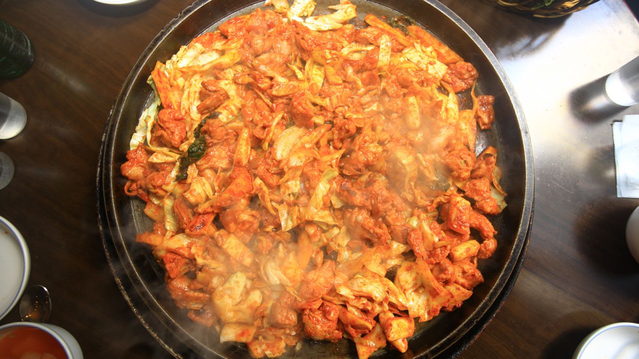 <strong>Chuncheon dakgalbi:</strong> In this dish, chunks of chicken are marinated in a sauce of chili paste and other spices, and stir-fried in a large pan with tteok, cabbage, carrots and slices of sweet potato.