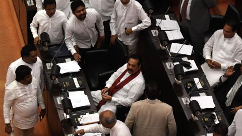 Sri Lanka's former president and newly appointed prime minister Mahinda Rajapakse (C) attends the parliament session in Colombo on November 14, 2018. 