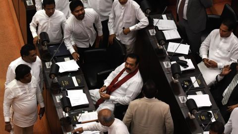 Sri Lanka's former president and newly appointed prime minister Mahinda Rajapakse (C) attends the parliament session in Colombo on November 14, 2018.