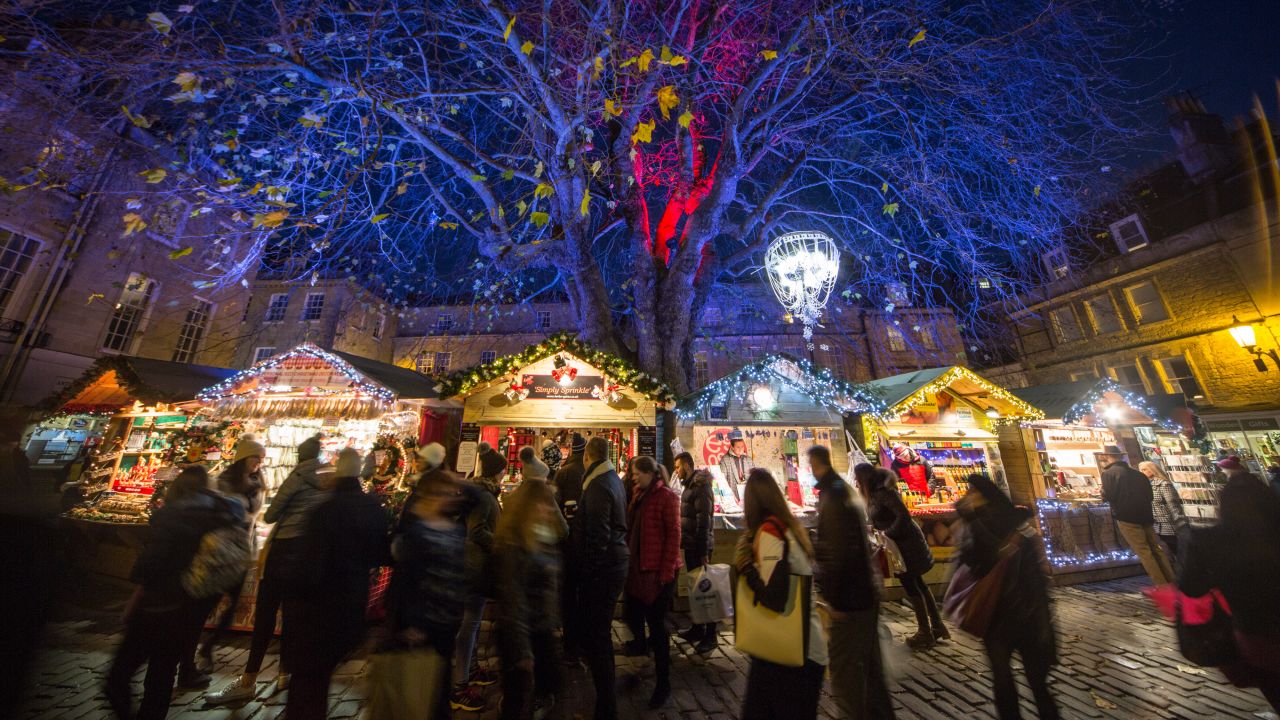 <strong>Bath, England:</strong> Shoppers browse stalls at the traditional Christmas market close to the historic Roman Baths.
