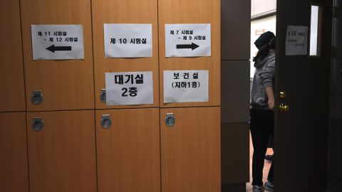 A student enters an exam room to take the annual College Scholastic Ability Test, a standardised exam for college entrance, at a high school in Seoul on November 23, 2017.