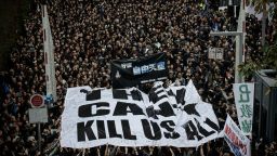 Protesters display a large banner during a rally to support press freedom in Hong Kong on March 2, 2014. The rally was staged following the attack of a former editor of local liberal newspaper which comes at a time of growing unease over freedom of the press in the southern Chinese city, with mounting concerns that Beijing is seeking to tighten control over the semi-autonomous region.  AFP PHOTO / Philippe Lopez        (Photo credit should read PHILIPPE LOPEZ/AFP/Getty Images)