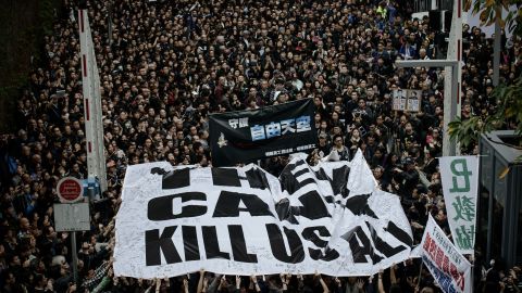 Protesters display a large banner during a rally to support press freedom in Hong Kong on March 2, 2014.