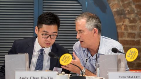 Victor Mallet, a Financial Times journalist and vice president of the Foreign Correspondents' Club (FCC) (right) speaks with Andy Chan, founder of the Hong Kong National Party, during a luncheon at the FCC in Hong Kong.