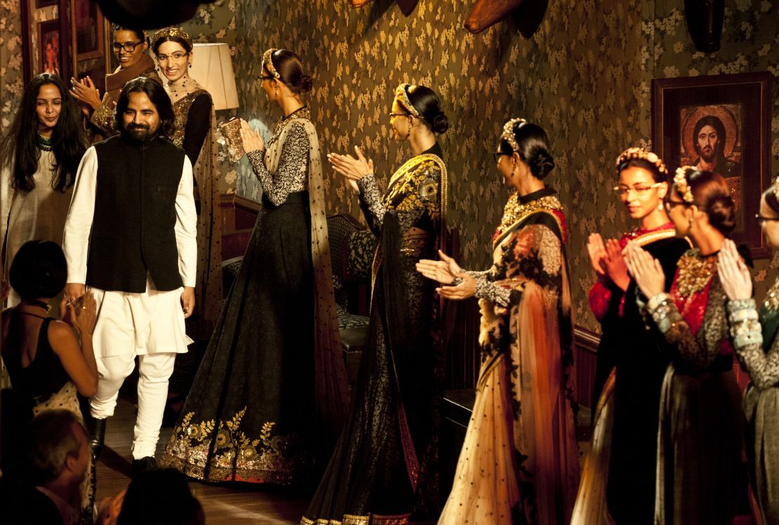 Sabyasachi takes to the stage at the end of a fashion show in New Delhi in 2012.