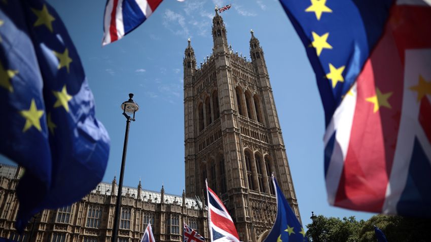 LONDON, ENGLAND - JUNE 11:  EU and Union Jack flags are waved as anti-Brexit demonstrators gather outside the Houses of Parliament on June 11, 2018 in London, England. The EU withdrawal bill returns to the House of Commons tomorrow for the first of two sessions in which MP's will consider amendments imposed by the Lords, and another set of fresh amendments.  (Photo by Dan Kitwood/Getty Images)