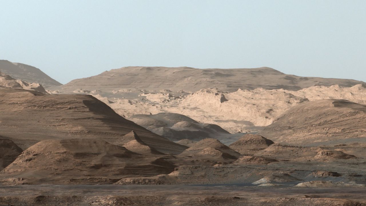 Curiosity took images in September 2015 of Mount Sharp, a hematite-rich ridge, a plain full of clay minerals to create a composite and rounded buttes high in sulfate minerals. The changing mineralogy in these layers of Mount Sharp suggests a changing environment in early Mars, though all involve exposure to water billions of years ago.