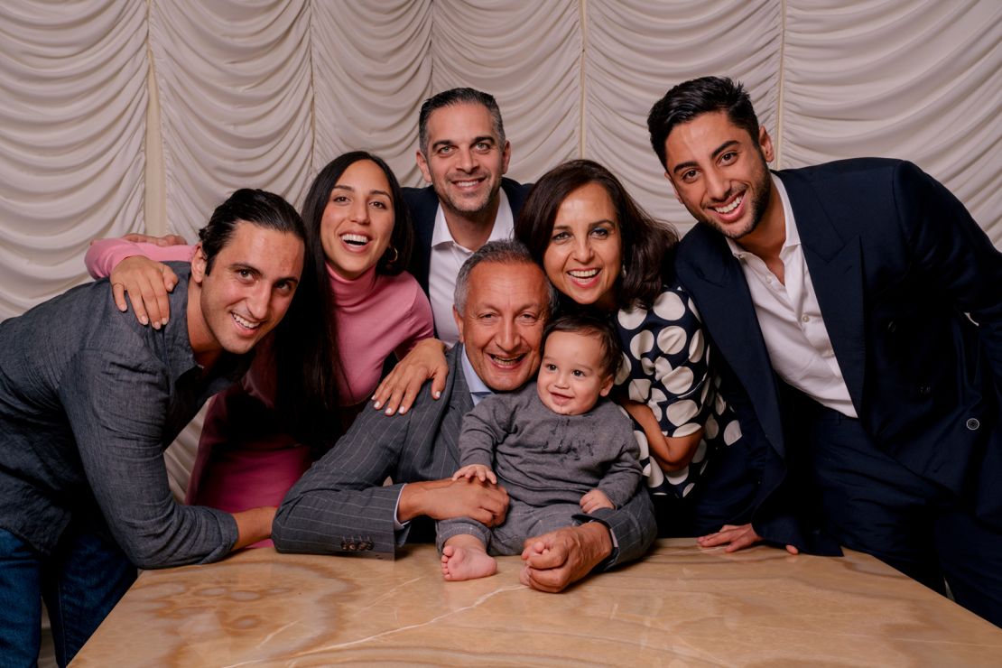 Larian with his wife and family, including his 8 month old grandson.