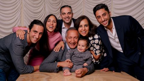Larian with his wife and family, including his 8 month old grandson.
