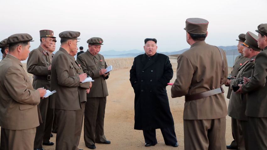 In this undated photo released Friday, Nov. 16, 2018, by the North Korean government, North Korean leader Kim Jong Un, center, listens to a military official as he inspects a weapon testing at the Academy of National Defense Science, North Korea. Kim observed the successful test of a "newly developed high-tech tactical" weapon, the nation's state media reported Friday, Nov. 16, 2018,  though it didn't describe what sort of weapon it was. Independent journalists were not given access to cover the event depicted in this image distributed by the North Korean government. The content of this image is as provided and cannot be independently verified. Korean language watermark on image as provided by source reads: "KCNA" which is the abbreviation for Korean Central News Agency. (Korean Central News Agency/Korea News Service via AP)