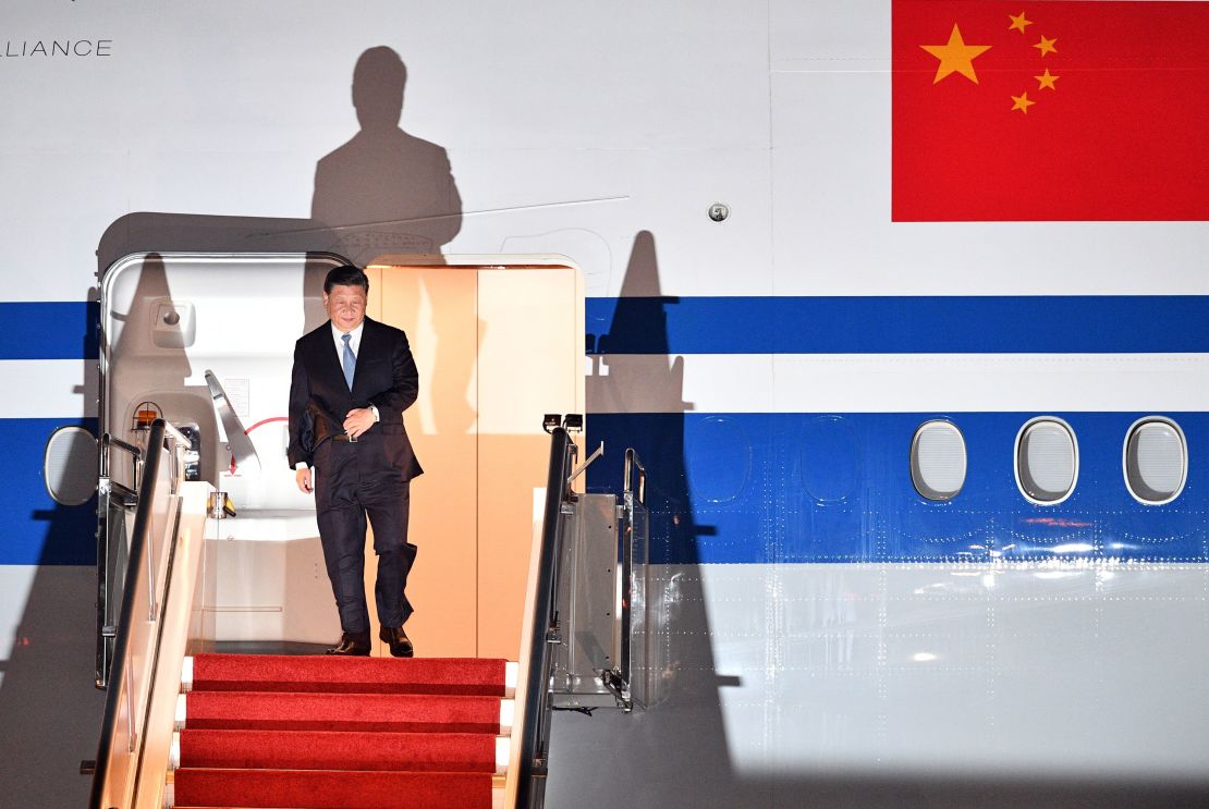 China's President Xi Jinping walks down the stairs of his plane upon arrival at Port Moresby International Airport on November 15.