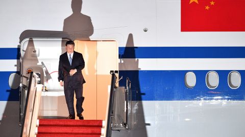 China's President Xi Jinping walks down the stairs of his plane upon arrival at Port Moresby International Airport on November 15.