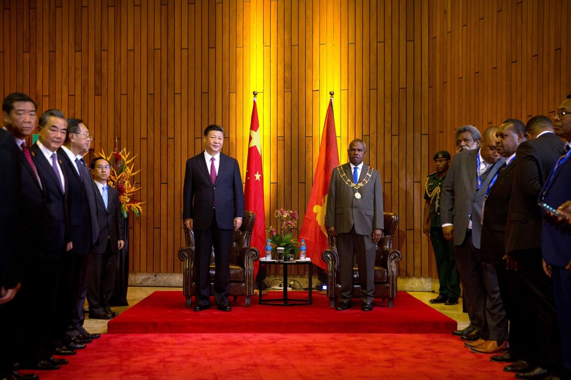 China's President Xi and Papua New Guinea's Governor General Bob Dadae stand before a meeting at Parliament House in Port Moresby on November 16.