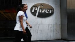 NEW YORK, NY - JULY 11: People pass the Pfizer headquarters  in Manhattan on July 11, 2018 in New York City. A day after President Donald Trump pressured the pharmaceutical giant with a critical tweet, Pfizer has agreed to reverse or postpone drug price hikes. (Photo by Spencer Platt/Getty Images)