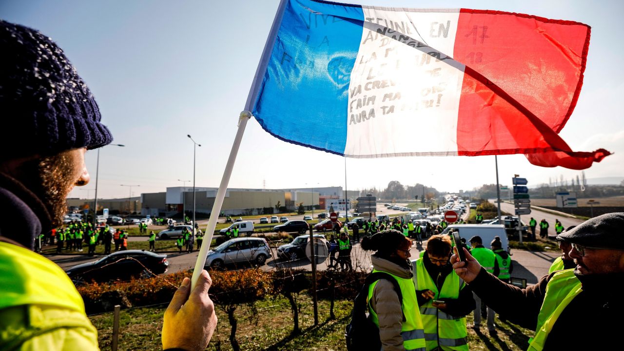 Demonstrators block a roundabout in Molsheim, eastern France, on Saturday in the protest over rising fuel taxes.