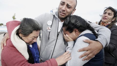 Relatives of the missing embrace Thursday in Mar del Plata after observing the sub's disappearance.