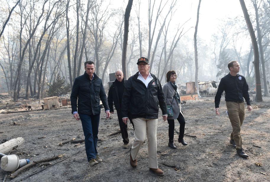 From left, California Gov.-elect Gavin Newsom, California Gov. Jerry Brown, President Donald Trump, Paradise Mayor Jody Jones and FEMA Administrator Brock Long survey damage left by the Camp Fire in Paradise, California, on Saturday, November 17. The death toll from the Camp Fire has risen to 76 and more than 1,200 people remain unaccounted for.