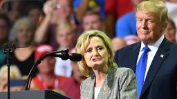 Senator Cindy Hyde-Smith (L) stands on stage with US President Donald Trump at a "Make America Great Again" rally at Landers Center in Southaven, Mississippi, on October 2, 2018. (Photo by MANDEL NGAN / AFP)        (Photo credit should read MANDEL NGAN/AFP/Getty Images)