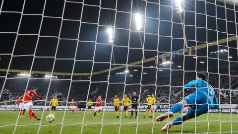 Swiss defender Ricardo Rodriguez shoots from the penalty spot to score his team's first goal against Belgium.