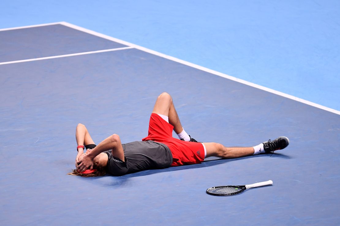 Alexander Zverev sunk to the court after winning the World Tour Finals Sunday.