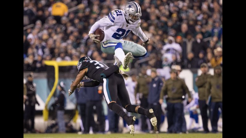 Dallas Cowboys running back Ezekiel Elliott hurdles over Philadelphia Eagles defensive back Tre Sullivan during the second quarter at Lincoln Financial Field in Philadelphia, Pennsylvania, on November 11.