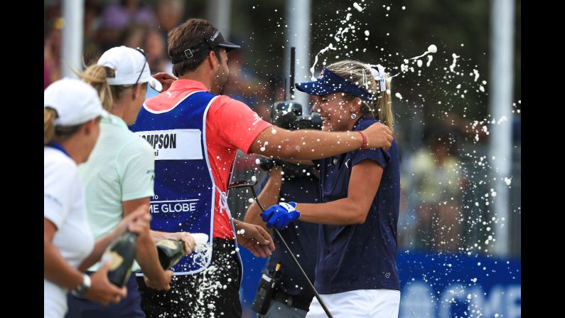 Lexi Thompson and her brother, Curtis Thompson, who is also her caddie, are showered in champagne after winning the LPGA CME Group Tour Championship at Tiburon Golf Club in Naples, Florida on Sunday, November 18. The win marked Thompson's 10th of her career and first since September 2017.
