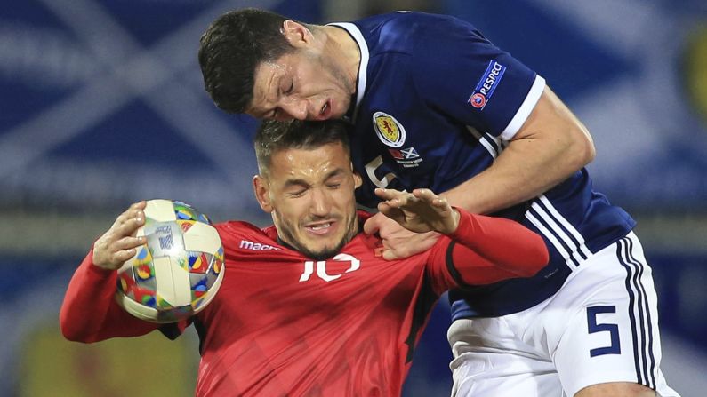Scotland's Scott McKenna, right, and Albania's Rei Manaj jump for the ball during the UEFA Nations League soccer match between Albania and Scotland at Loro Borici Stadium, in Shkoder, Albania on Saturday, November 17.
