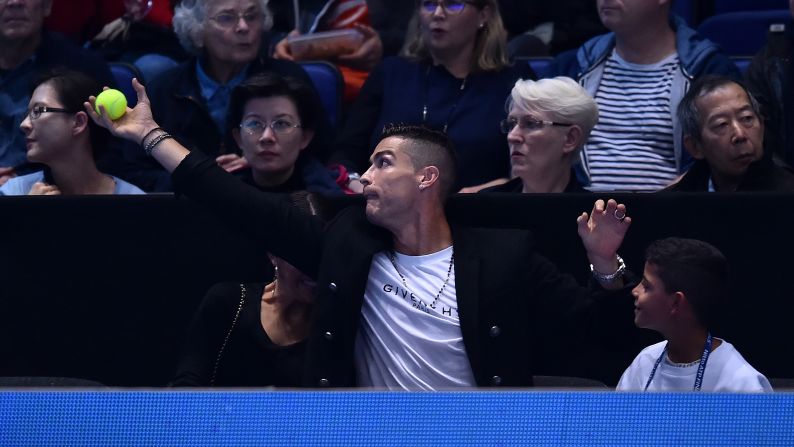 Juventus forward Cristiano Ronaldo catches a stray ball during a tennis match between Novak Djokovic and John Isner at the ATP World Tour Finals tennis tournament in London on November 12.