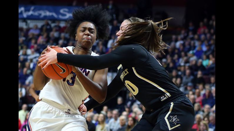 Vanderbilt Commodores guard Cierra Walker strips the ball from University of Connecticut Huskies guard Christyn Williams during a women's college basketball game on November 17 at Mohegan Sun Arena in Uncasville, Connecticut. 