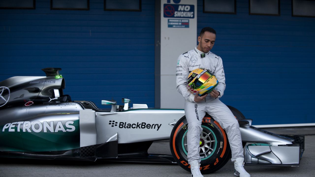 Five-time F1 champion Lewis Hamilton poses at the unveiling of the Mercedes W05.