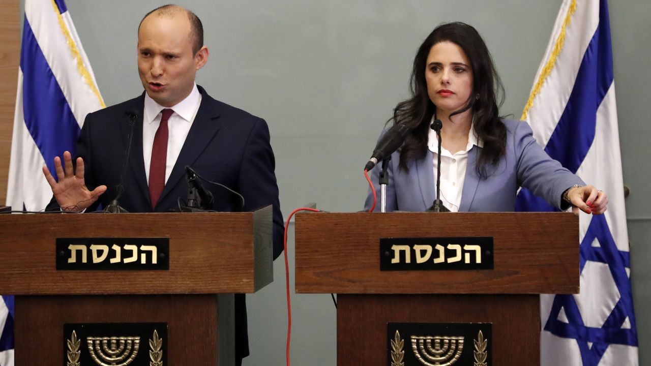 Israeli Education Minister Naftali Bennett (L) speaks as he and Justice Minister Ayelet Shaked (R) give a statement at the Knesset in Jerusalem on November 19, 2018.