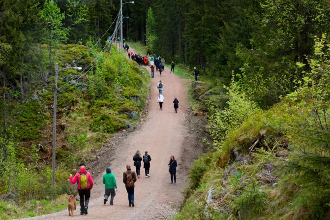 People make their way to the Handover ceremony in the Nordmarka forest just outside Oslo. 