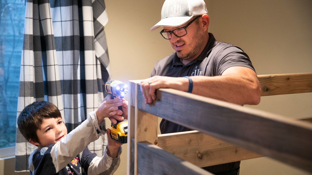 Mickelson was shocked to learn that there were needy children in his town who were forced to sleep on the floor because they had no beds. "There's kids next door whose parents are struggling just to put food on the table, clothes on their back, a roof over their head," Mickelson says. "A bed was just a luxury." Using safety guidelines and his daughter's bunk bed as a template, Mickelson started using his own money to buy wood and supplies to build beds for these children.