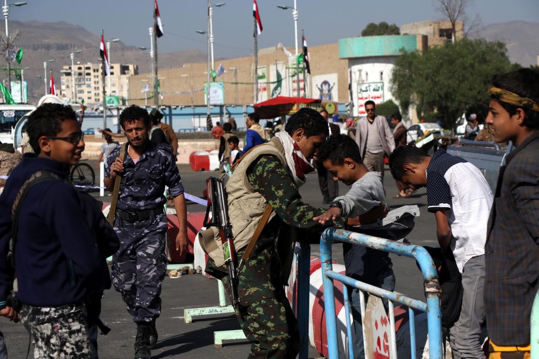 Houthi fighters check people entering a square for a rally last month in Sanaa.