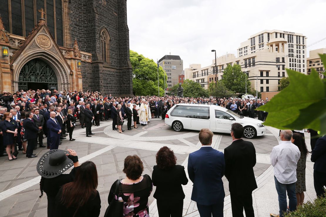 The hearse carrying the body of Sisto Malaspina leaves during the state funeral for Sisto Malaspina at St. Patrick's Cathedral on Tuesday in Melbourne.