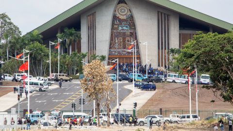 Papua New Guinea police and soldiers are pictured outside the front of the country's parliament in Port Moresby on November 20, 2018.