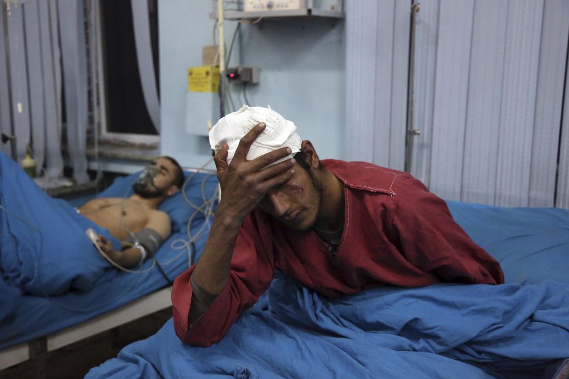 An injured men receives treatment at a hospital after the suicide bombing in Kabul.