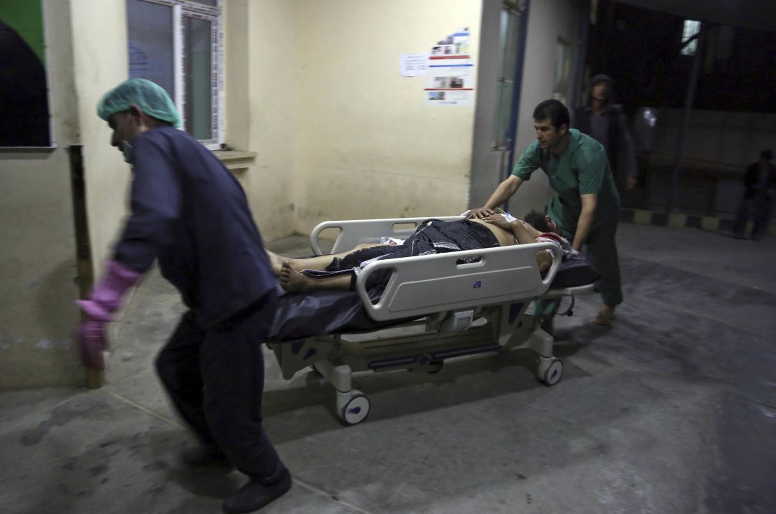 A man injured in the suicide bombing in Kabul is brought into a hospital.