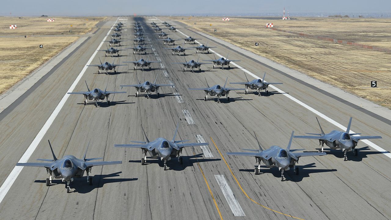 Dozens of US Air Force F-35 fighters taxi on the runway in preparation for a combat power exercise on Nov. 19, 2018, at Hill Air Force Base, Utah. 