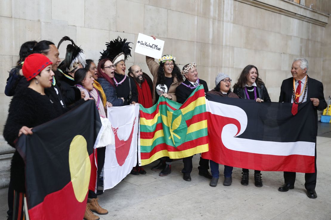 Demonstrators hold flags and banners outside the British Museum requesting the return of Hoa Hakananai'a.