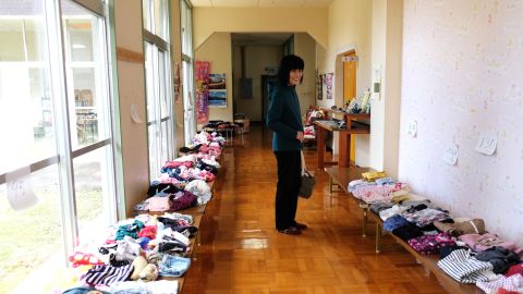Nobue Sasaki stands in the hallway of the Nagi Child Home.