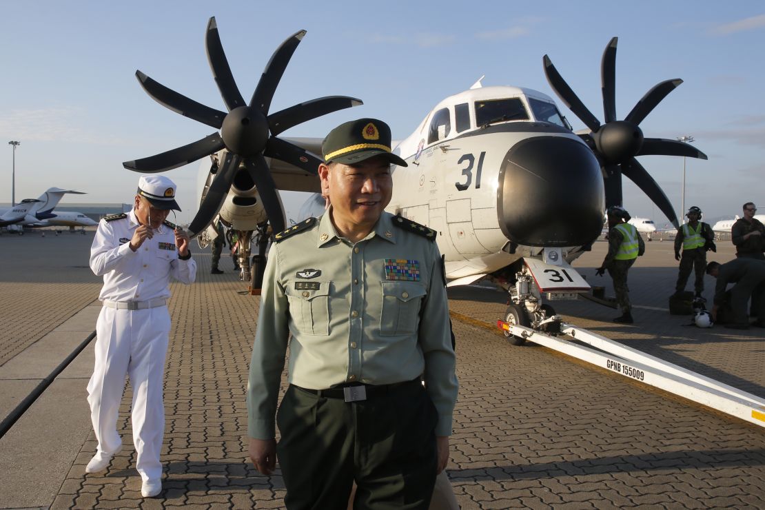 Tan Benhong, a lieutenant general of the People's Liberation Army (PLA) of China, arrives Hong Kong airport after visiting the USS Ronald Reagan on Tuesday.