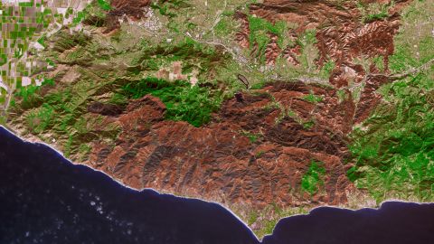 The burned areas from the Woolsey Fire are brown; unburned vegetation is green. The light gray or white areas are buildings, roads and other developed areas.
