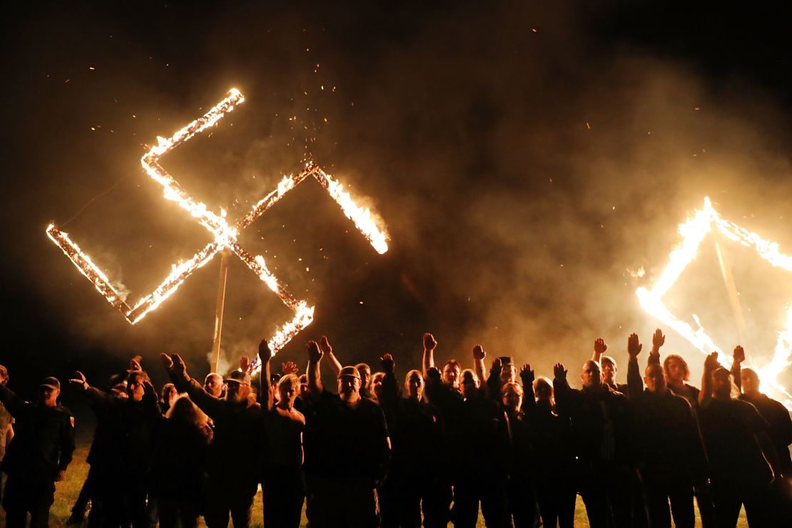 One of the largest neo-Nazi groups in the US had a swastika burning after a rally this April in Draketown, Georgia.