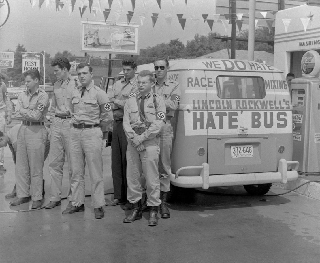 George Lincoln Rockwell, center, leader of the American Nazi Party, with followers and his "hate bus" in Alabama in 1961.